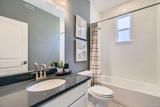 full bathroom with toilet, shower / tub combo, and vanity