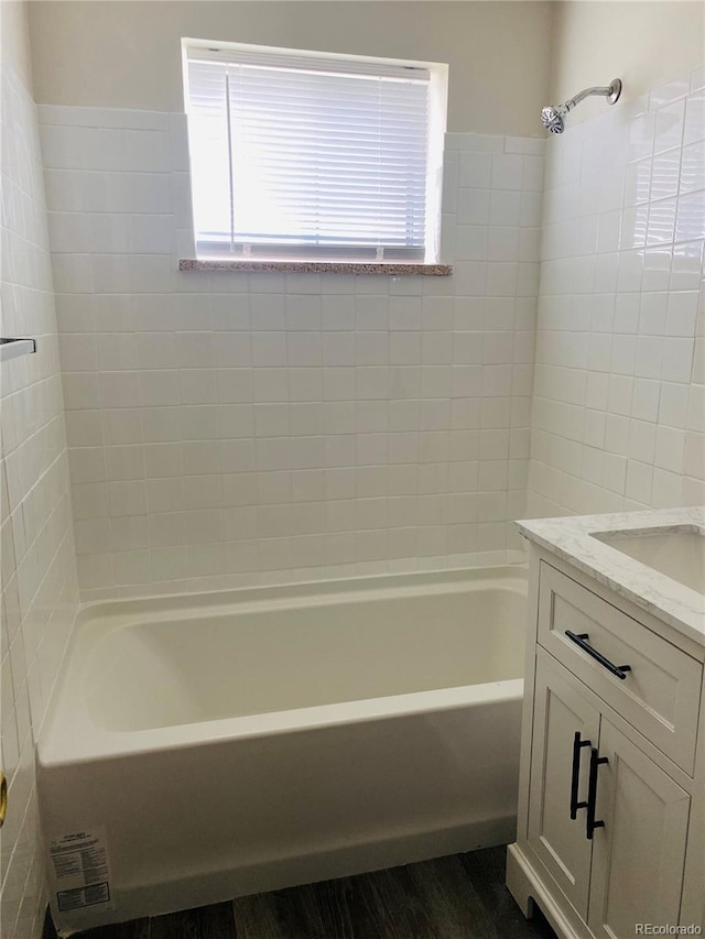 3728 N Vance St Unit 1-4, Wheat Ridge, CO 80033 - bathroom with plenty of natural light, vanity, and washtub / shower combination