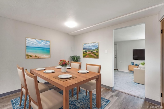 3728 N Vance St Unit 1-4, Wheat Ridge, CO 80033 - dining area with wood finished floors and baseboards