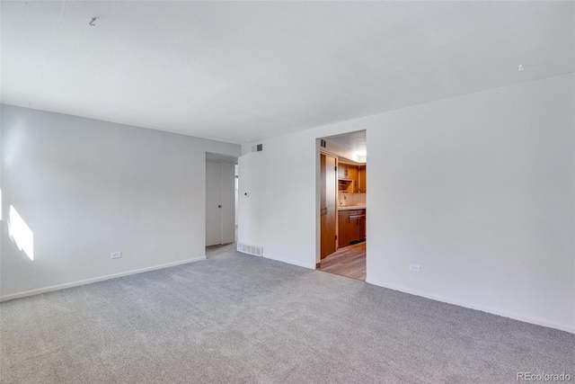 3728 N Vance St Unit 1-4, Wheat Ridge, CO 80033 - unfurnished room featuring light colored carpet and baseboards