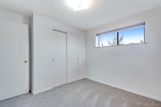3728 N Vance St Unit 1-4, Wheat Ridge, CO 80033 - unfurnished bedroom with carpet flooring, a closet, and baseboards