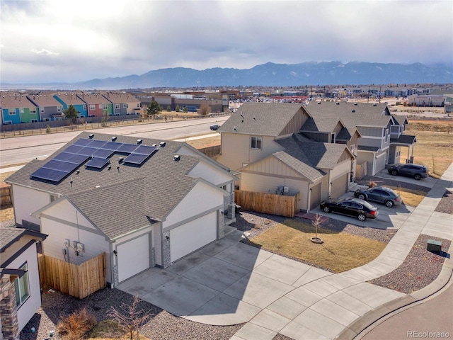 bird's eye view featuring a residential view and a mountain view