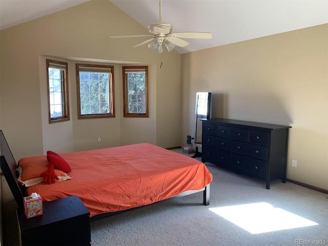 bedroom with lofted ceiling, carpet, a ceiling fan, and baseboards