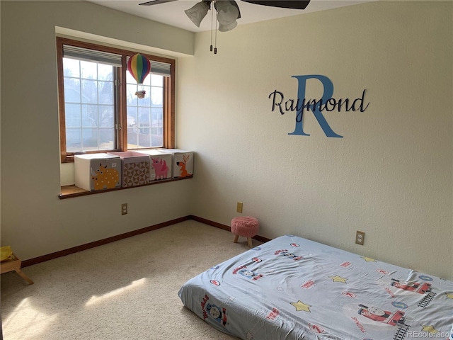 unfurnished bedroom featuring carpet floors, ceiling fan, and baseboards