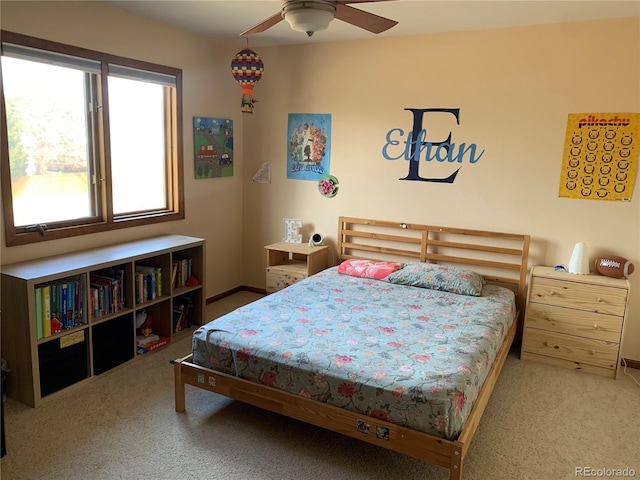 carpeted bedroom featuring baseboards