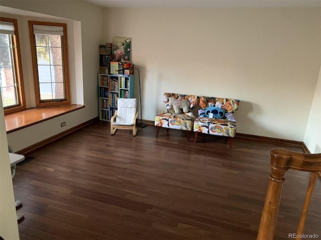 misc room featuring wood finished floors and baseboards