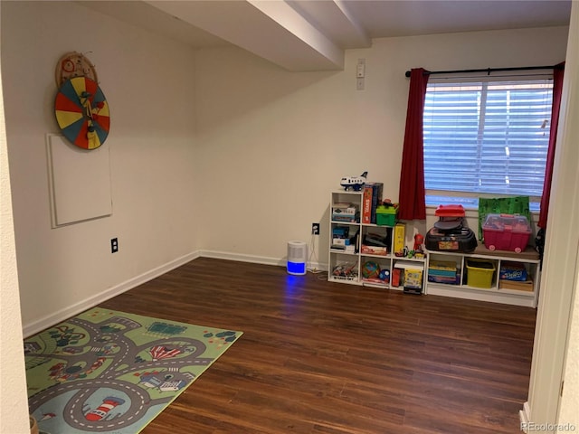 playroom with wood finished floors and baseboards