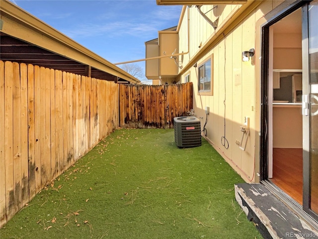 view of yard with central air condition unit