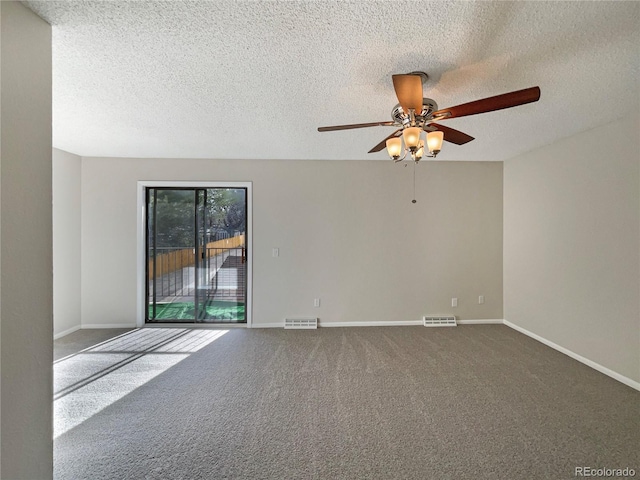 empty room with a textured ceiling, carpet floors, and ceiling fan