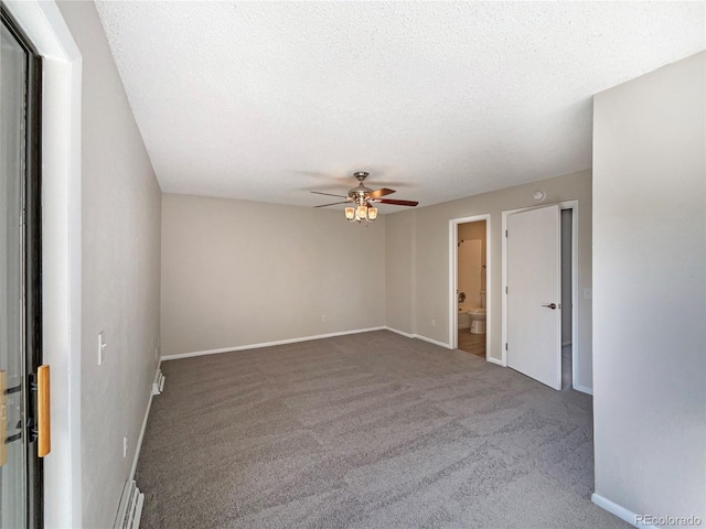 unfurnished room with carpet, ceiling fan, and a textured ceiling