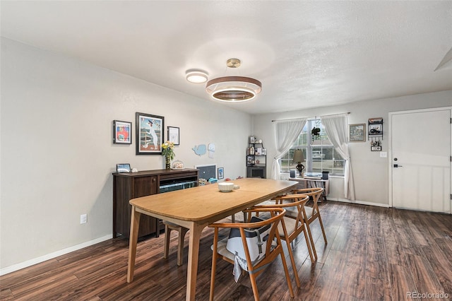 309 S 30th Ave, Brighton, CO 80601 - dining space featuring dark wood finished floors and baseboards