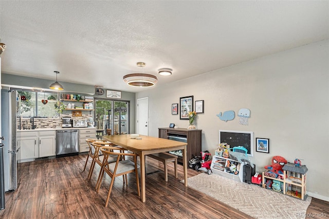 309 S 30th Ave, Brighton, CO 80601 - dining space with dark wood-type flooring and a textured ceiling
