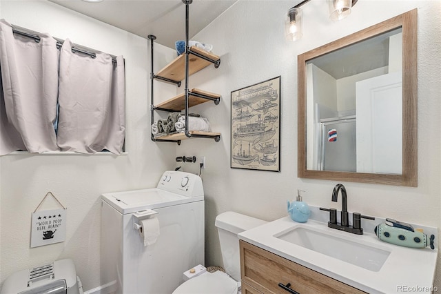 309 S 30th Ave, Brighton, CO 80601 - full bath with washer / dryer, vanity, and an enclosed shower