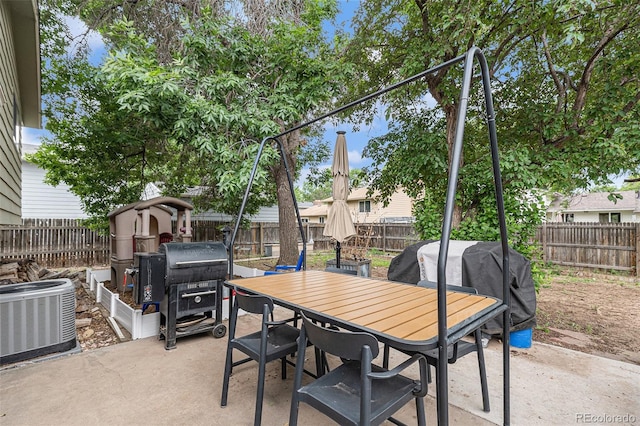309 S 30th Ave, Brighton, CO 80601 - fenced backyard with a patio area, outdoor dining space, and a grill