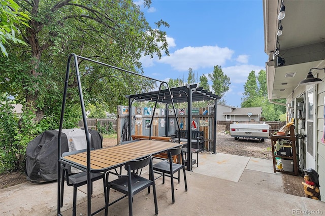 309 S 30th Ave, Brighton, CO 80601 - fenced backyard featuring grilling area, a pergola, a patio area, and outdoor dining area