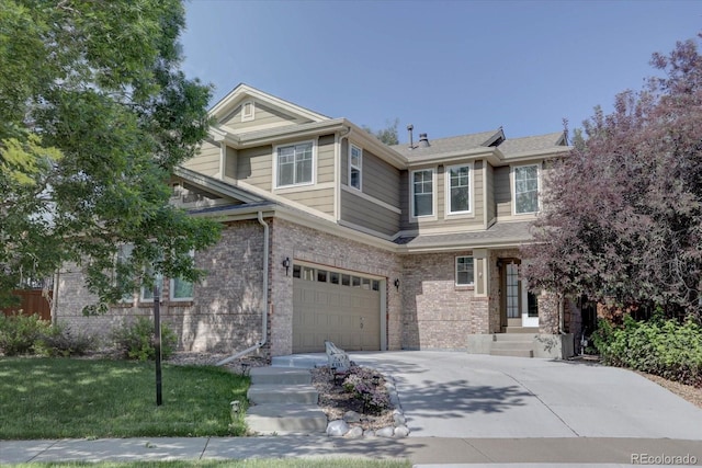 view of front facade with a front yard and a garage