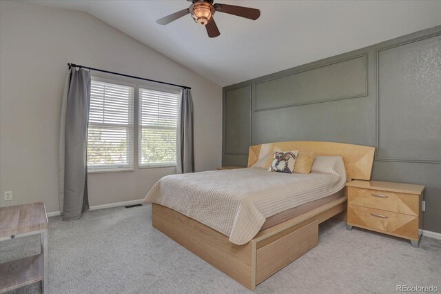 carpeted bedroom with lofted ceiling and ceiling fan