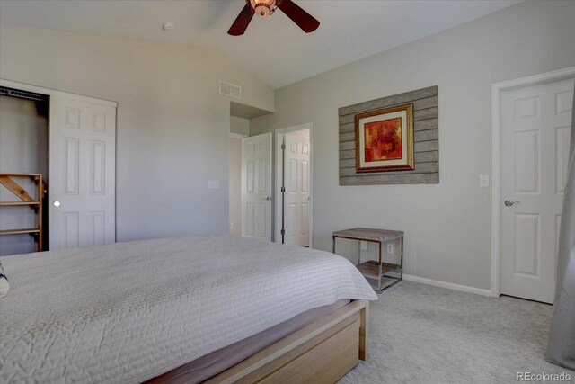 carpeted bedroom with vaulted ceiling and ceiling fan