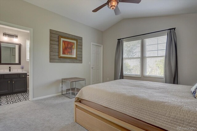 carpeted bedroom featuring ceiling fan, lofted ceiling, and ensuite bathroom