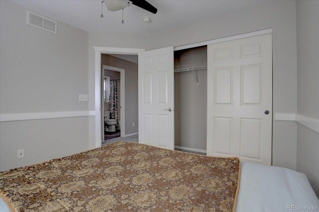 bedroom featuring ensuite bathroom, a closet, and ceiling fan