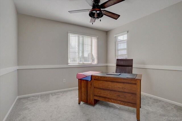 carpeted office with ceiling fan