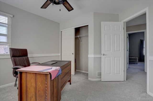 office featuring light carpet and ceiling fan