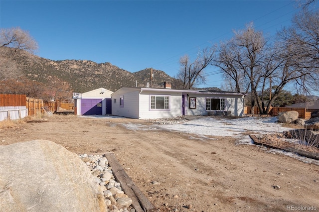 back of house featuring a mountain view