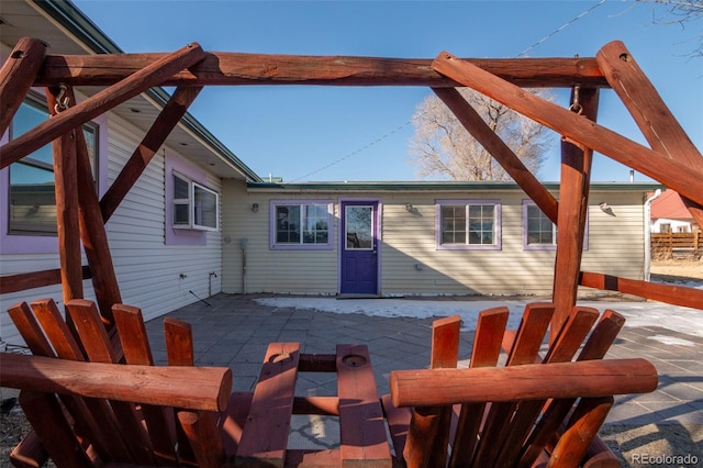 rear view of property featuring a patio