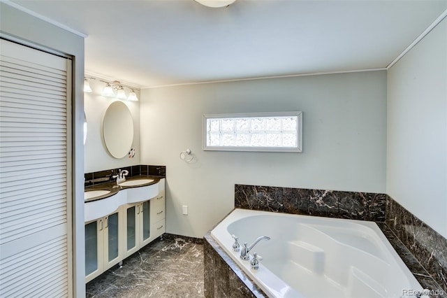 bathroom featuring crown molding, marble finish floor, double vanity, a sink, and a garden tub