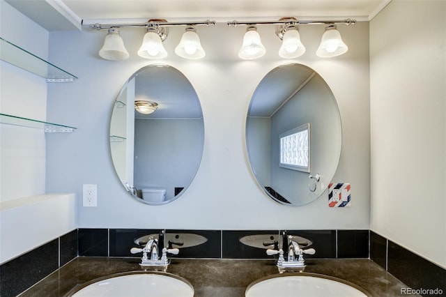 bathroom with double vanity and a sink