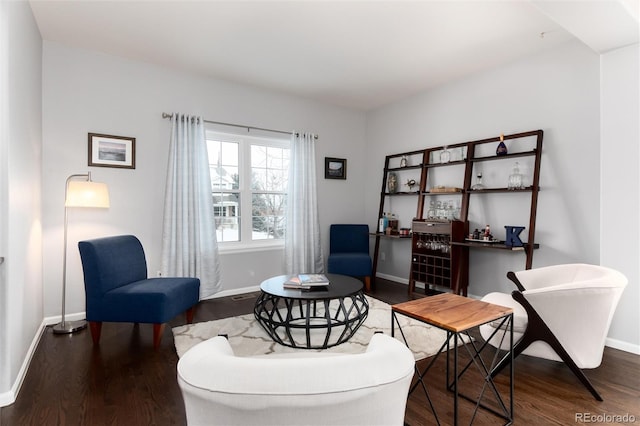 sitting room featuring dark hardwood / wood-style flooring