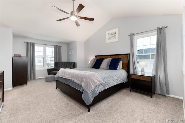 carpeted bedroom featuring ceiling fan and lofted ceiling