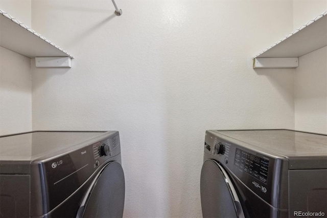 laundry area featuring washing machine and dryer and laundry area