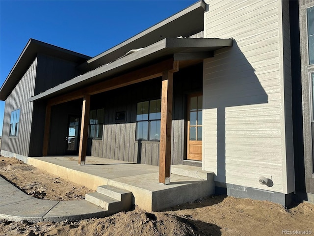 doorway to property featuring covered porch