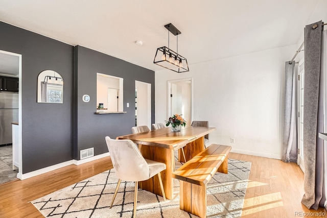 dining room with light hardwood / wood-style floors