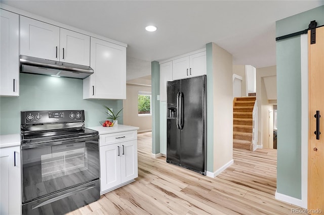 2140 W 135th Ave, Westminster, CO 80234 - kitchen featuring black appliances, under cabinet range hood, light wood-type flooring, light countertops, and recessed lighting
