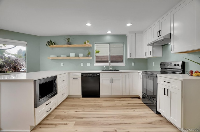 2140 W 135th Ave, Westminster, CO 80234 - kitchen featuring black appliances, under cabinet range hood, a sink, open shelves, and light countertops