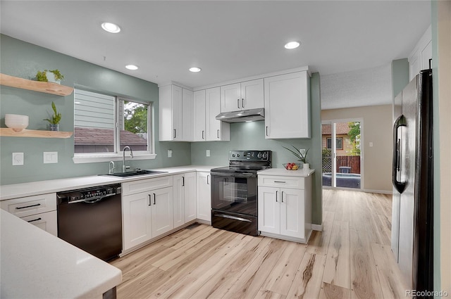 2140 W 135th Ave, Westminster, CO 80234 - kitchen featuring black appliances, a sink, under cabinet range hood, light wood-type flooring, and white cabinetry