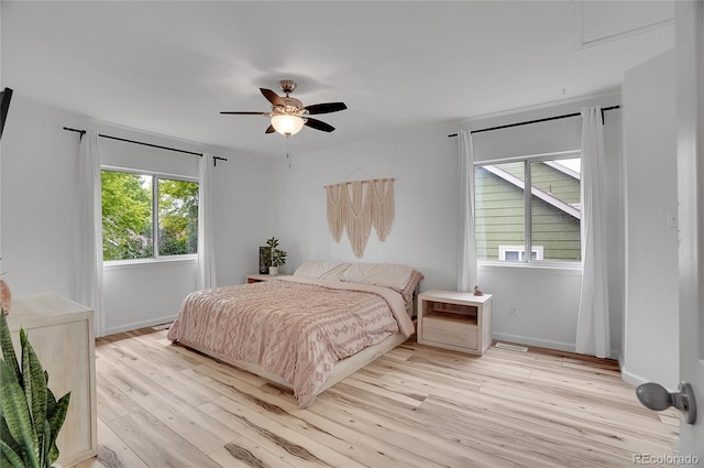 2140 W 135th Ave, Westminster, CO 80234 - bedroom featuring light wood finished floors, baseboards, and a ceiling fan
