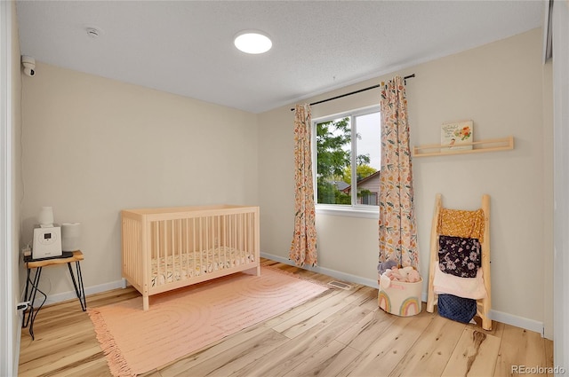 2140 W 135th Ave, Westminster, CO 80234 - bedroom featuring wood finished floors and baseboards