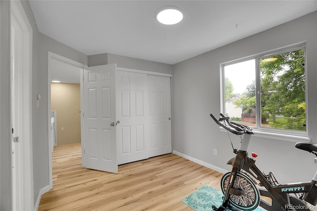 2140 W 135th Ave, Westminster, CO 80234 - exercise room with light wood-style flooring and baseboards