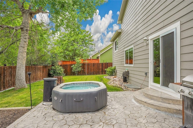 2140 W 135th Ave, Westminster, CO 80234 - view of patio / terrace featuring a hot tub and area for grilling