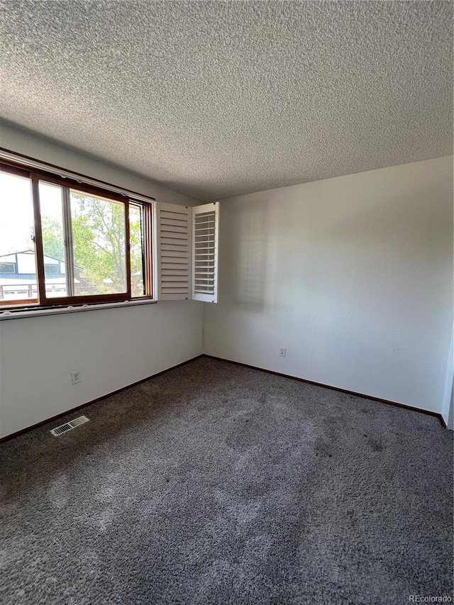 15983 E Loyola Dr, Aurora, CO 80013 - carpeted spare room featuring visible vents and a textured ceiling