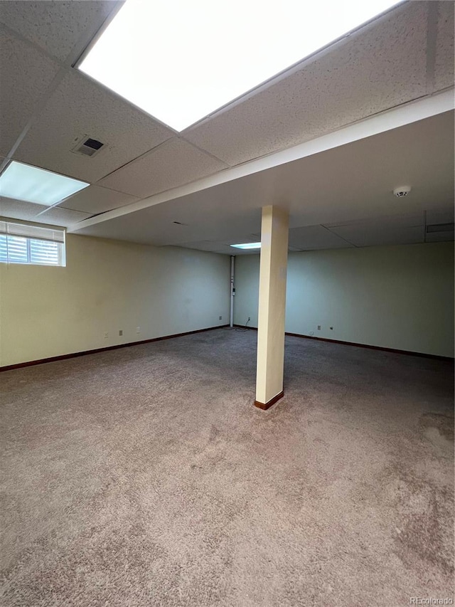 15983 E Loyola Dr, Aurora, CO 80013 - below grade area with carpet flooring, baseboards, visible vents, and a paneled ceiling