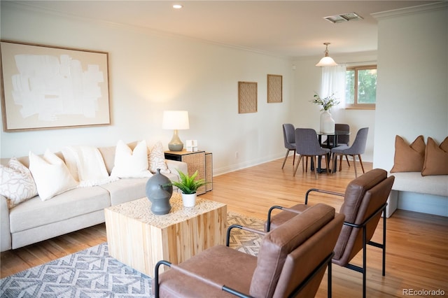 7270 S Cherry Dr, Centennial, CO 80122 - living area featuring crown molding, wood finished floors, and recessed lighting