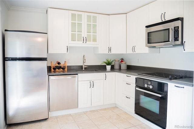 7270 S Cherry Dr, Centennial, CO 80122 - kitchen with black appliances, dark countertops, white cabinets, glass insert cabinets, and ornamental molding