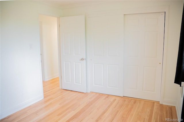 7270 S Cherry Dr, Centennial, CO 80122 - unfurnished bedroom featuring light wood finished floors, a closet, and ornamental molding