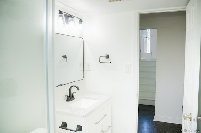 7270 S Cherry Dr, Centennial, CO 80122 - bathroom featuring vanity and baseboards