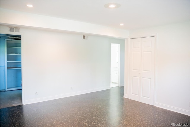 7270 S Cherry Dr, Centennial, CO 80122 - empty room with recessed lighting and speckle patterned floor