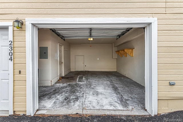 garage featuring electric panel and a garage door opener